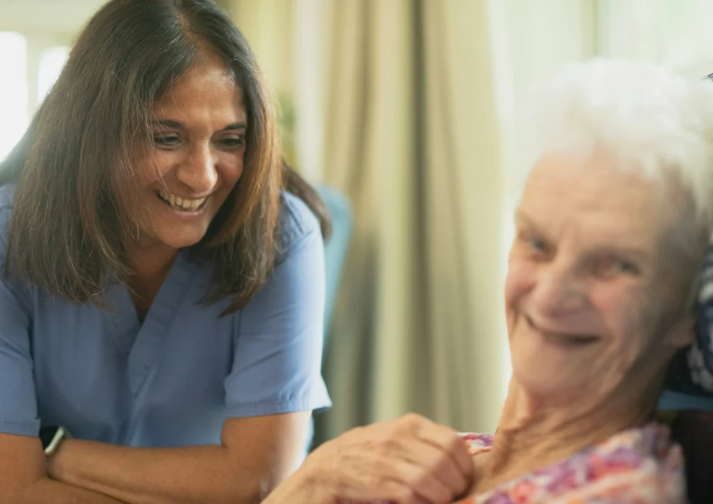 Caregiver providing compassionate care and support to an elderly resident