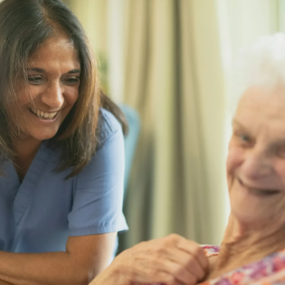 Caregiver providing compassionate care and support to an elderly resident