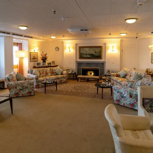 Warm and welcoming care home lounge with comfortable seating
