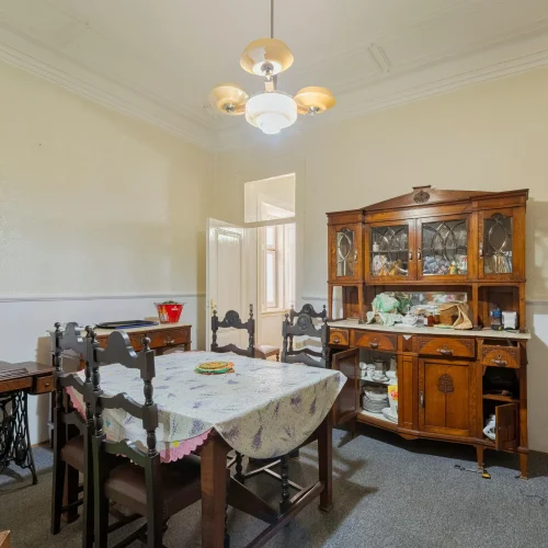 Traditional care home dining room with a large table and comfortable chairs