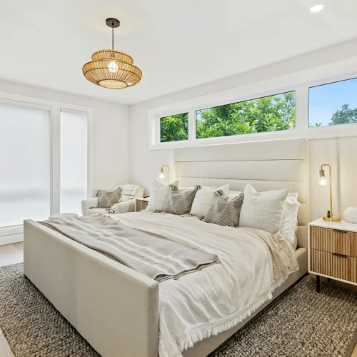 Bright and comfortable care home bedroom with a double bed and natural light